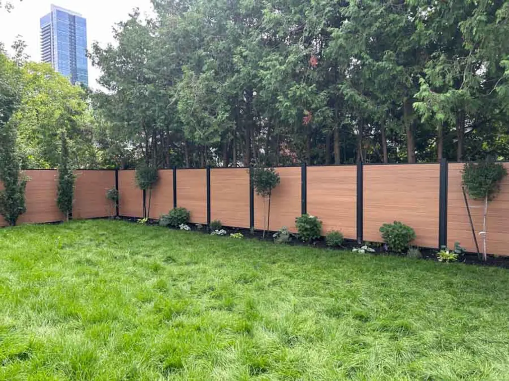 huge back yard with fence and landscaping by Kerta Construction