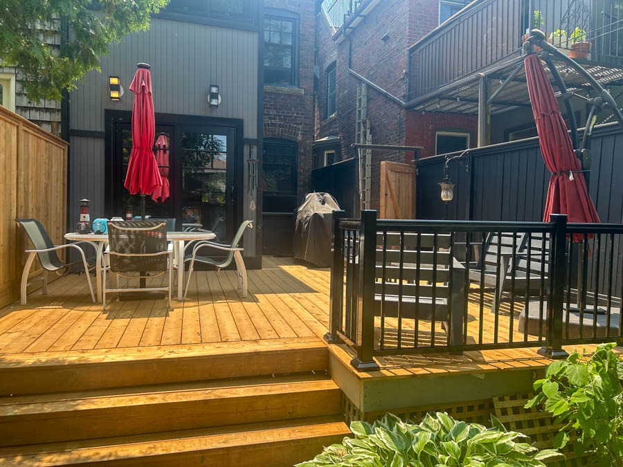 back deck with steps and black railings by Kerta Construction