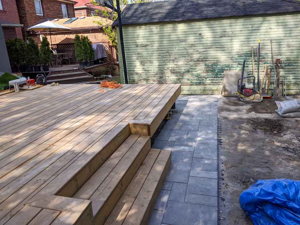 Portfolio-img-31 deck with steps and a patio by Kerta Construction