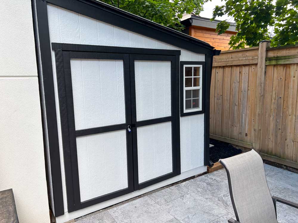 Portfolio-img-34 black and white shed on a patio by Kerta Construction
