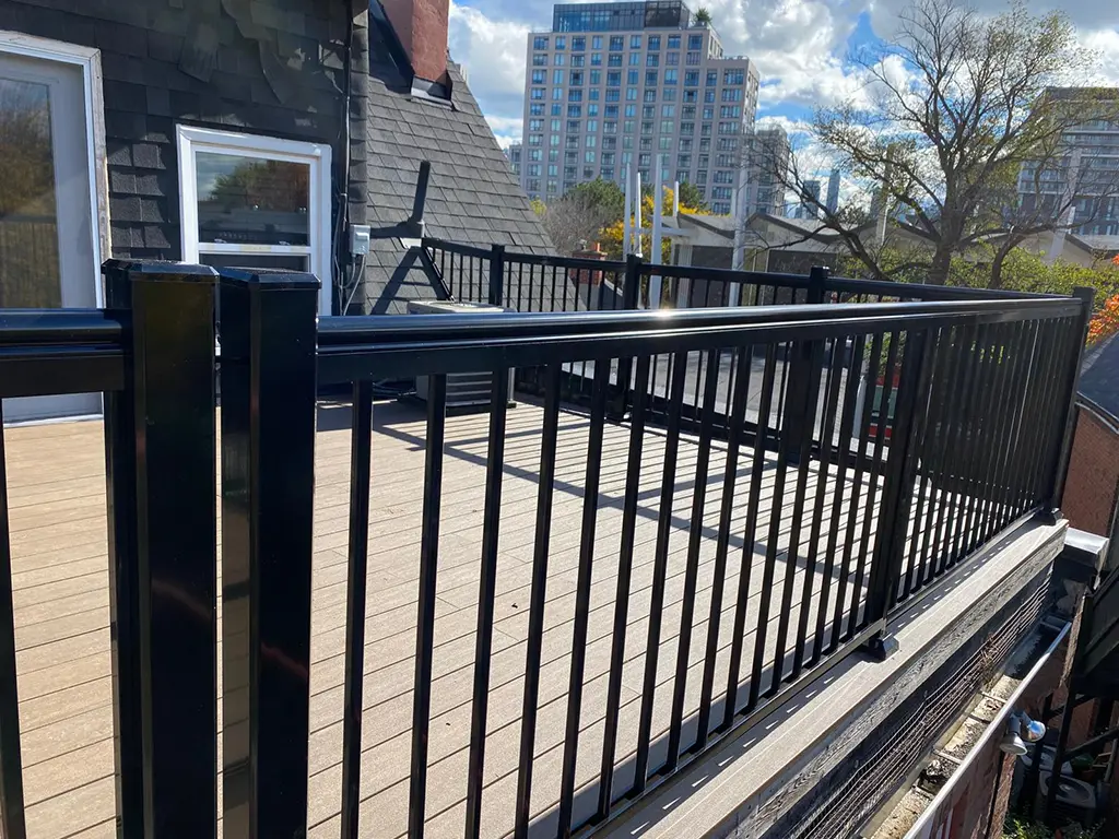 Portfolio-img-39 deck with black railings in the city by Kerta Construction