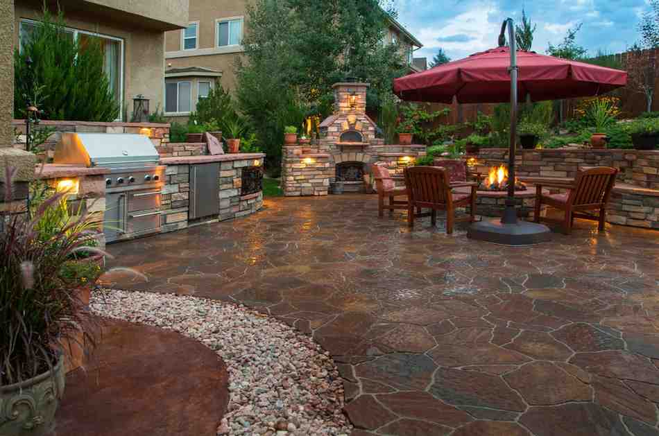 Cozy Outdoor Patio Featuring Stylish Seating and Landscaping by Kerta Construction
