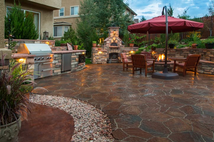 Outdoor living space with patio, fire pit, and seating area in Toronto, ON